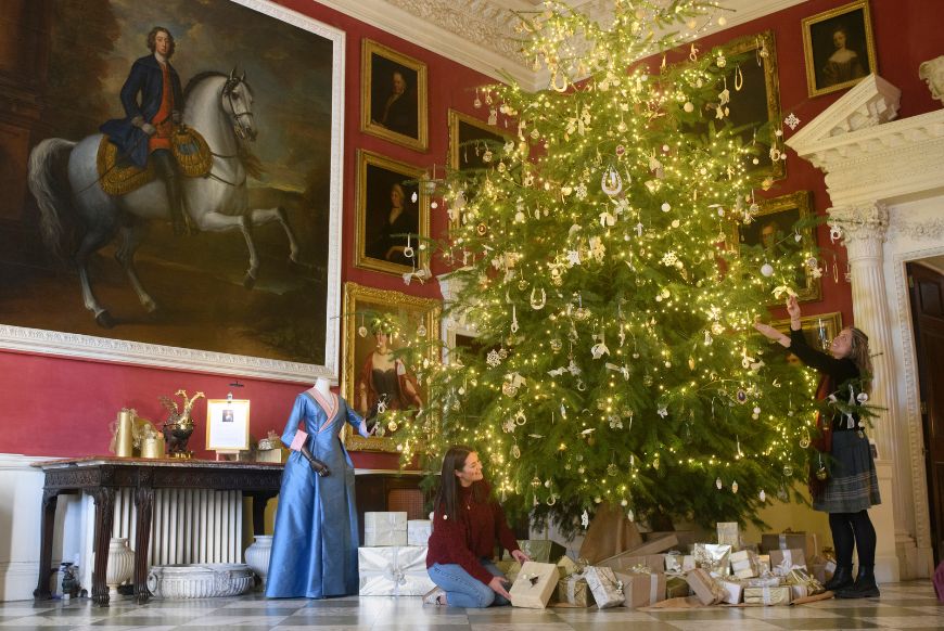Staff members putting the final touches to the decorations in the Entrance Hall in the house at Stourhead